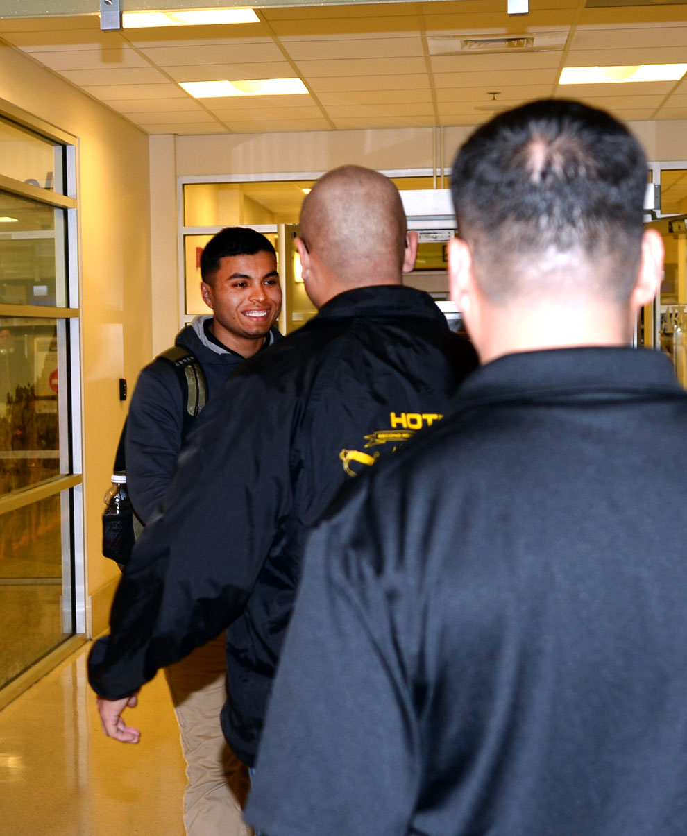 Sgt. Joshua Robles (front) training noncommissioned officer, Military Operations and Training Branch, Marine Corps Logistics Base Albany, is met at the Southwest Georgia Regional Airport in Albany, Georgia, by fellow Marines Feb. 7 after a six-month deployment to Kuwait.