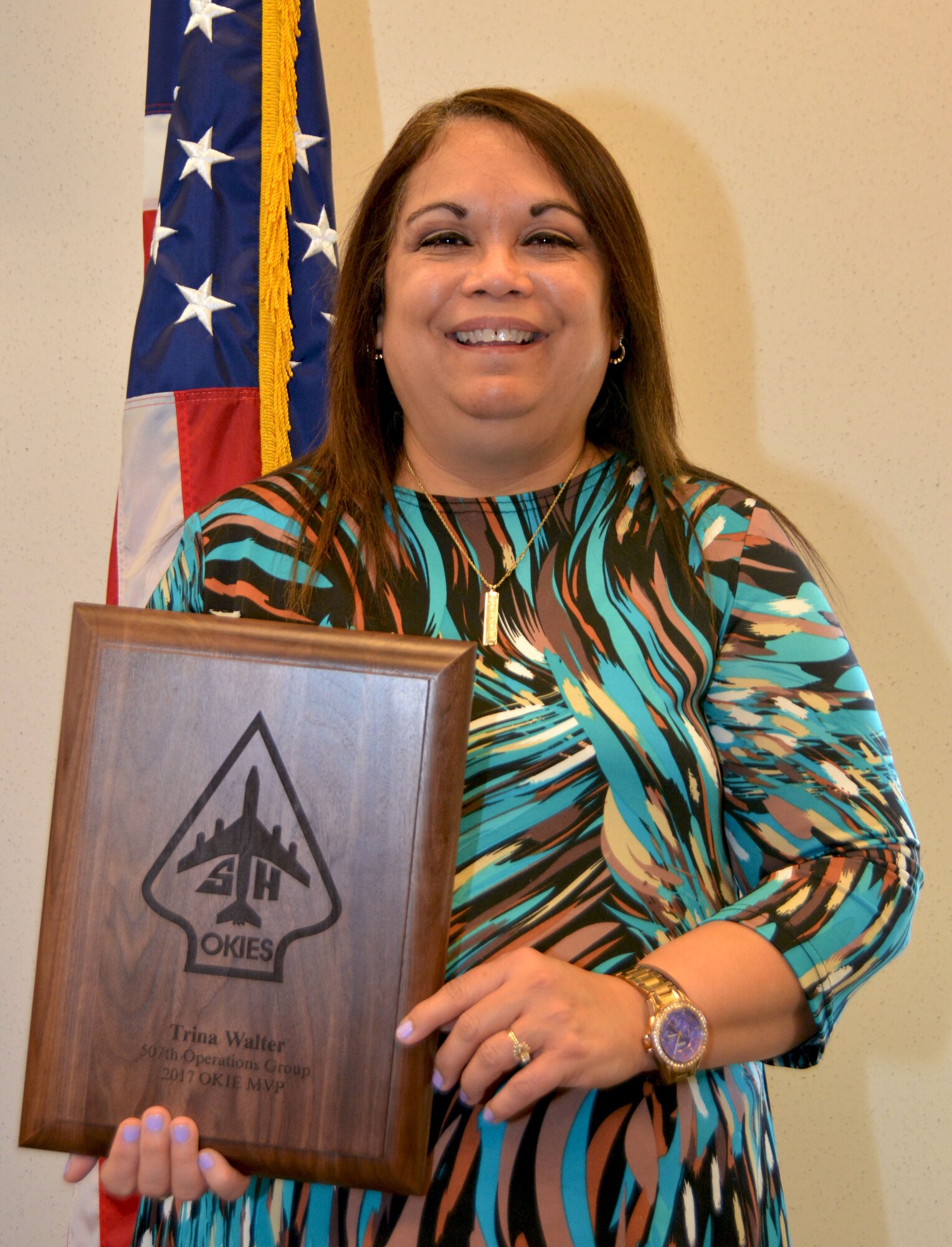 Mrs. Trina Walter, 507th Operations Group, holds the 507th Operations Group 2017 Okie MVP award Feb. 8, 2018, at Tinker Air Force Base, Okla. Walter was recognized by the 507th OG for outstanding performance and dedication to the mission throughout 2017. (U.S. Air Force photo/Tech. Sgt. Samantha Mathison)