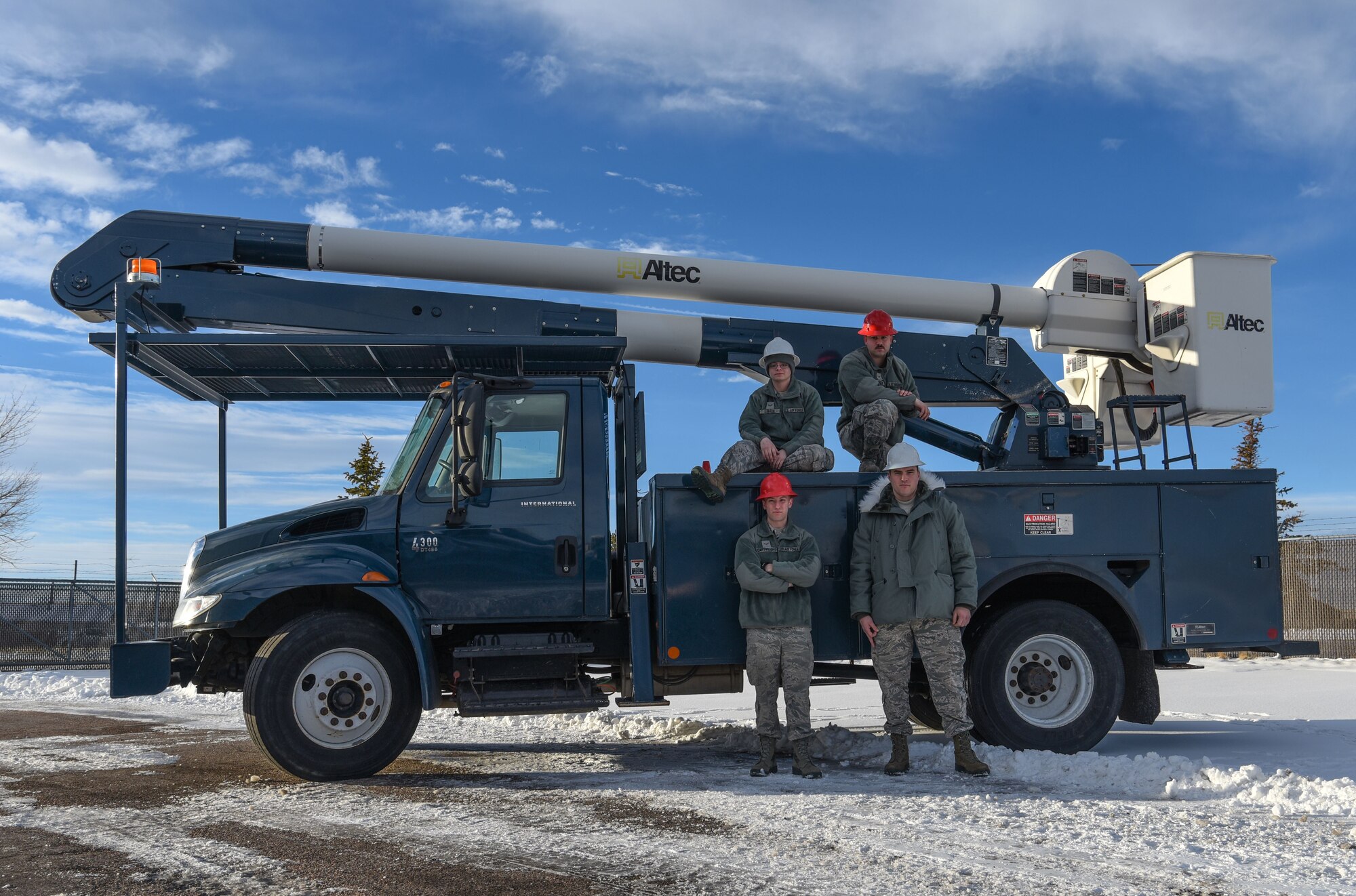 Airmen from the 90th Civil Engineer Squadron electrical shop pose for a photo Feb. 2, 2018, on F.E. Warren Air Force Base Wyo. Every single area on F.E. Warren is touched by the electrical shop, ensuring the mission runs without interruption day in and day out. (U.S. Air Force photo by Airman 1st Class Braydon Williams)