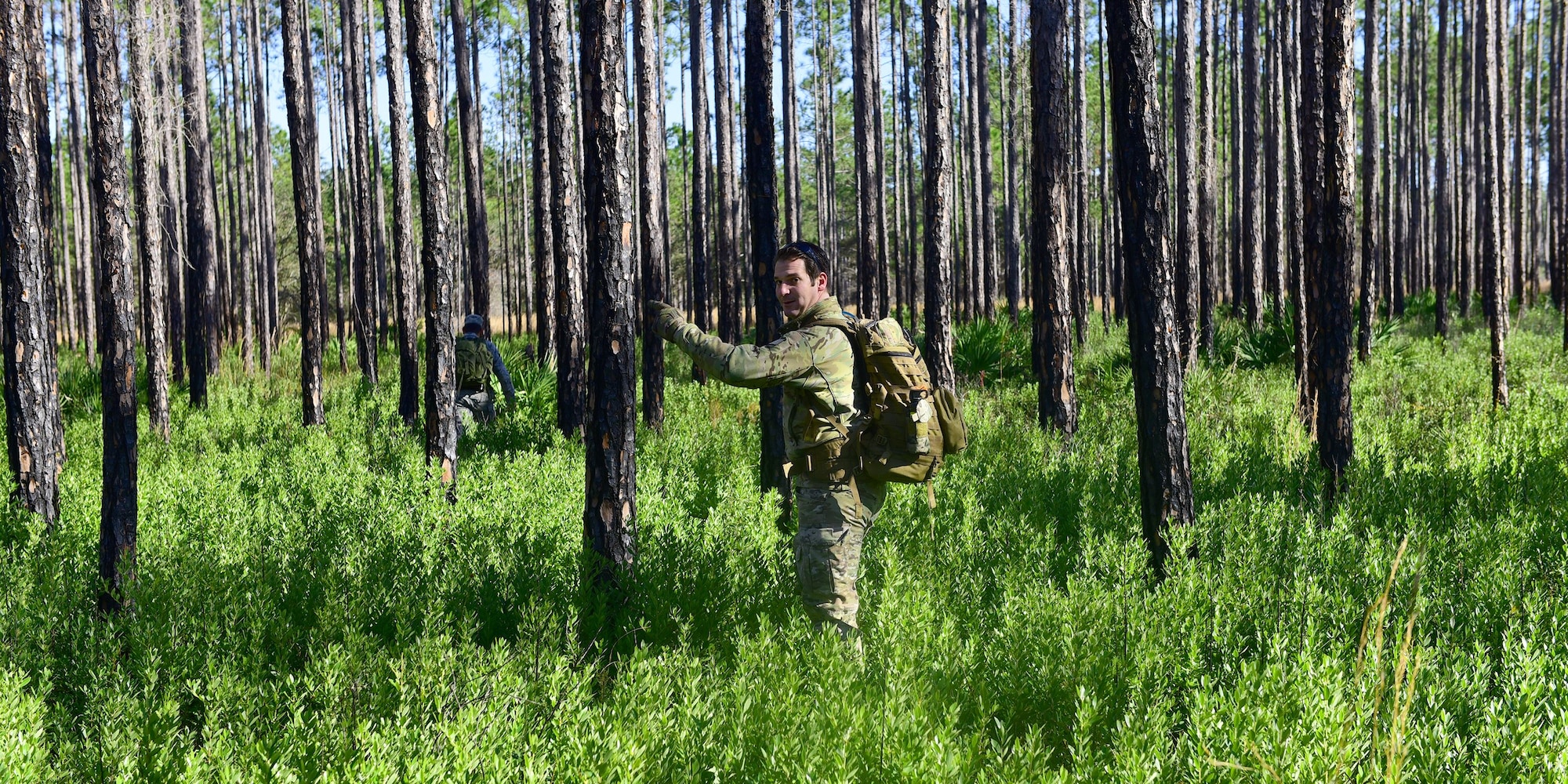Staff Sgt. Jonathan Buchanan, 325th Operations Support Squadron NCO in-charge of SERE operations and training, surveys a potential training area around Tyndall Air Force Base for Tyndall’s SERE program, Jan. 17, 2018. The SERE specialists at Tyndall have the special duty of ensuring that all qualifying personnel keep their training up-to-date and refreshed. (U.S. Air Force photo by Senior Airman Cody R. Miller/Released)