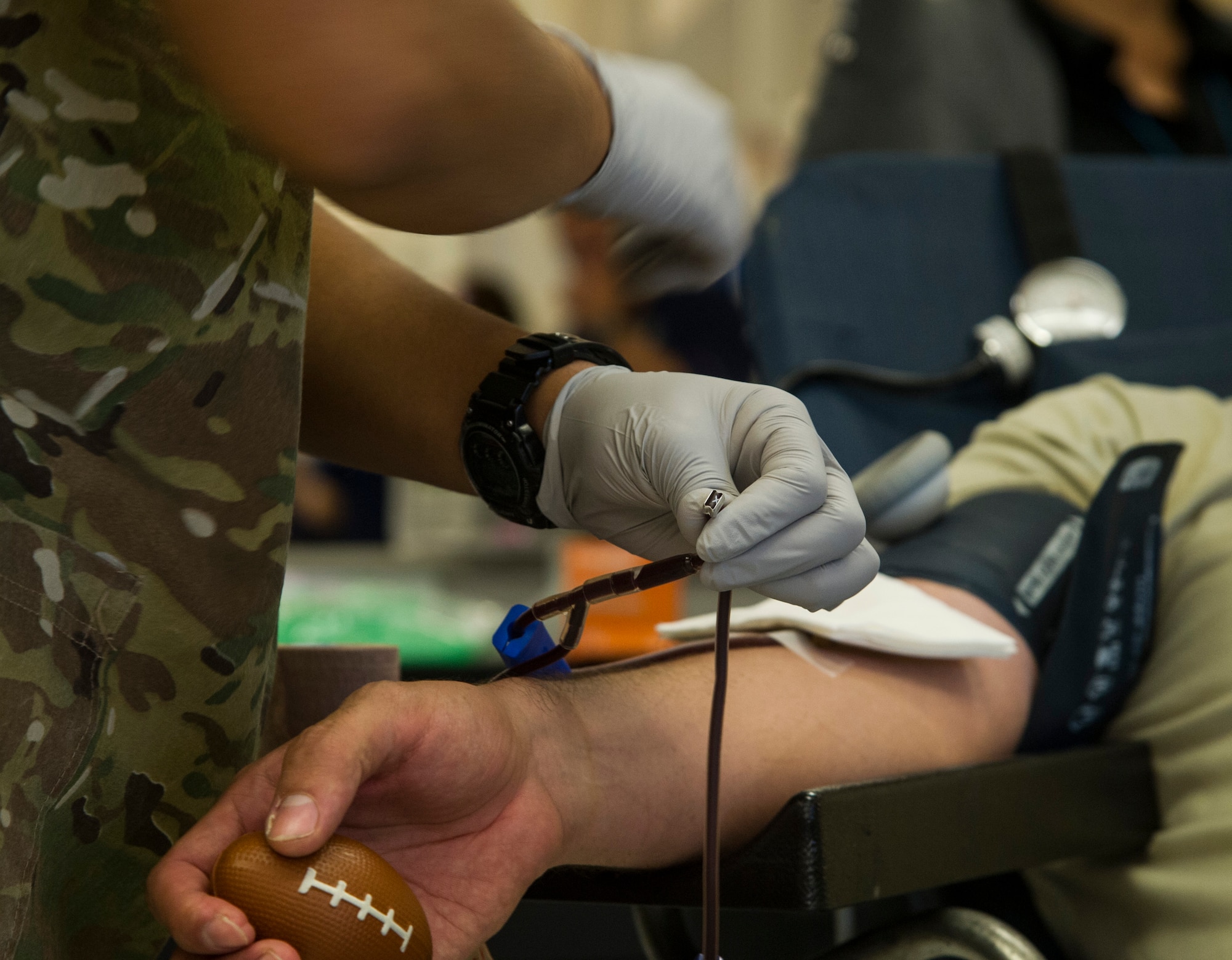 A phlebotomist assigned to Tripler Army Medical Center, seals off a unit of donated blood during a blood drive at the Base Exchange, at Joint Base Pearl Harbor-Hickam, Feb. 6, 2018. The Tripler Army Medical Center Blood Donor Center holds multiple donation events a week, along with their clinic hours, to collect blood that will be used to treat military members, families, and veterans at home and abroad. (U.S. Air Force photo by Tech. Sgt. Heather Redman)