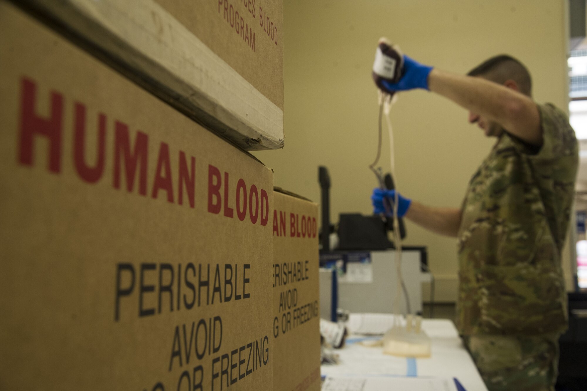 A phlebotomist assigned to Tripler Army Medical Center packages units of donated blood for transport during a blood drive at the Base Exchange, at Joint Base Pearl Harbor-Hickam, Feb. 6, 2018. The Tripler Army Medical Center Blood Donor Center holds multiple donation events a week, along with their clinic hours, to collect blood that will be used to treat military members, families, and veterans at home and abroad. (U.S. Air Force photo by Tech. Sgt. Heather Redman)