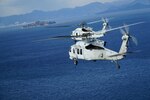 U.S. Navy MH-60R and MH-60S Seahawk helicopters, assigned to Helicopter Maritime Strike Squadron (HSM) 51 and Helicopter Sea Combat Squadron (HSC) 25 rendezvous off the coast of Hiroshima
