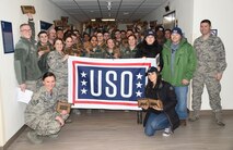 Members from the United Service Organizations based at Osan Air Base, Republic of Korea pose for a photo with the 8th Communications Squadron, Jan. 26, 2018. Due to Kunsan being a true remote tour,  the USO  from Osan visit once a month providing care packages to U.S. service members to show their support.  (U.S. Air Force photo by Senior Airman Colby L. Hardin)