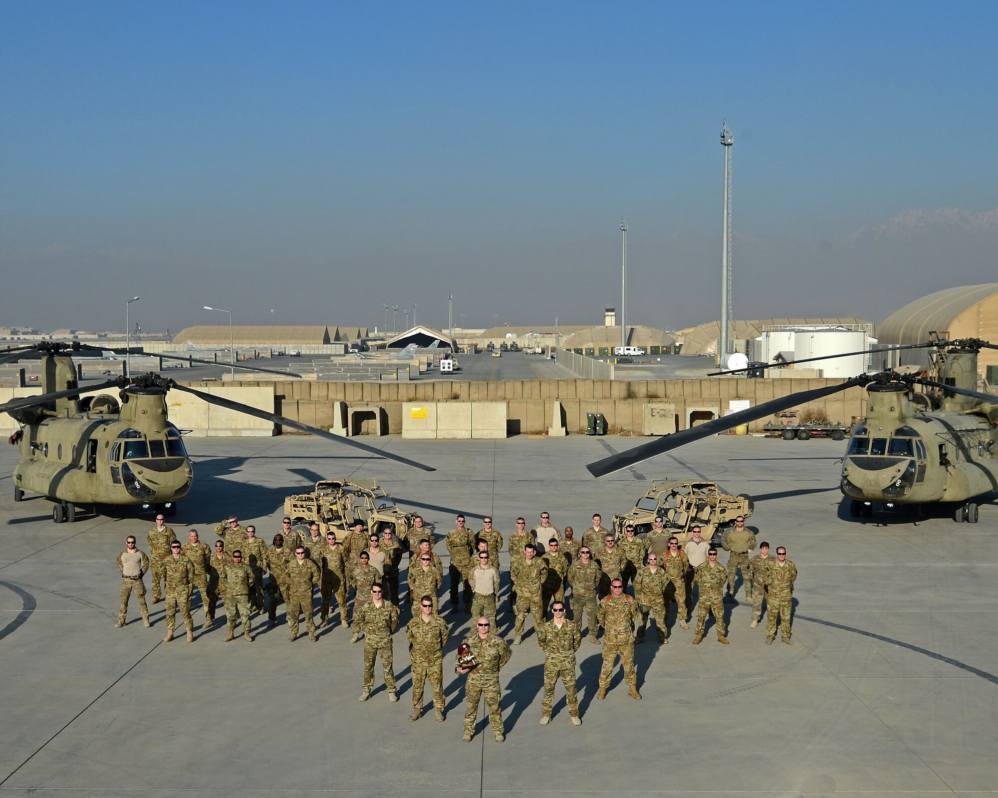 The 83rd Expeditionary Rescue Squadron poses for a photo at Bagram Airfield, Afghanistan. The 83rd ERQS is Air Force Central Command’s first dedicated joint personnel recovery team, utilizing Air Force Guardian Angel teams and Army CH-47 Chinook crews. (U.S. Air Force photo by Staff Sgt. Divine Cox)