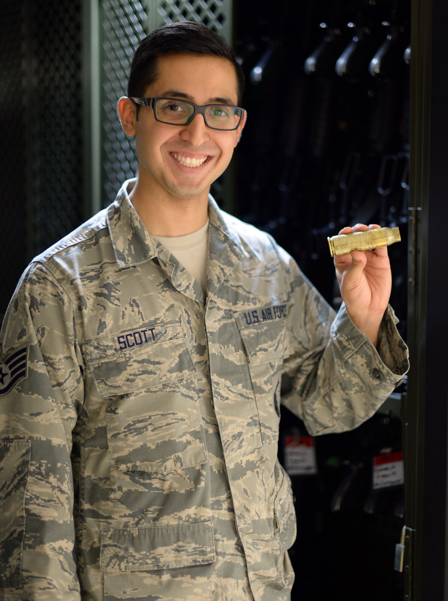 Staff Sgt. Alexander Scott, 52nd Security Forces Squadron armory noncommissioned officer in charge, shows off his recently awarded  "Chainbreaker" Award - the first of its kind here - at Spangdahlem Air Base, Germany, Jan. 26, 2018. The 52nd Fighter Wing Safety office created the award to recognize individual efforts made in the interest of safety.  (U.S. Air Force photo by Tech. Sgt. Austin M. May)