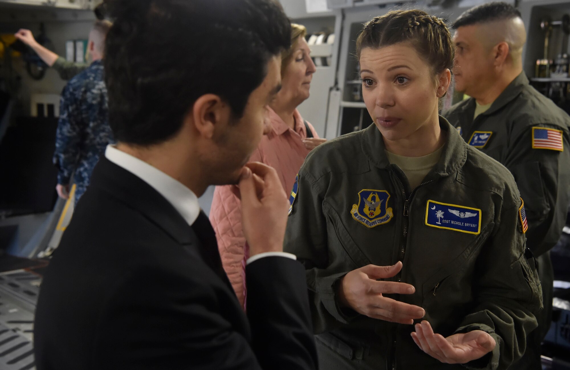 U.S. Air Force Staff Sgt. Nichole Bryant, 315th Aeromedical Evacuation Squadron, talks to a North Atlantic Treaty Organization Parliamentary Assembly Defense and Security Committee member during a tour of a C-17 Globemaster III as part of a Congressional Delegation and NATO Partners event Feb. 8, at Joint Base Charleston, S.C. The visit provided NATO PA members an opportunity to speak with JB Charleston leadership, tour a C-17 Globemaster III, receive a briefing focused on aeromedical evacuation and learn about the Transportation Isolation System’s capabilities.
