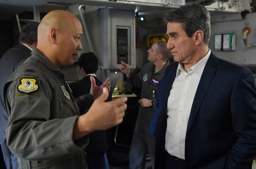 U.S. Air Force Col. Jimmy Canlas, left, 437th Airlift Wing commander, talks to Andreas Loverdos, right, North Atlantic Treaty Organization, Parliament Greece member, during a Congressional Delegation and NATO Partners event Feb. 8, at Joint Base Charleston, S.C. The visit provided NATO members an opportunity to speak with JB Charleston leadership, tour a C-17 Globemaster III, receive a briefing focused on aeromedical evacuation and learn about the Transportation Isolation System’s capabilities.