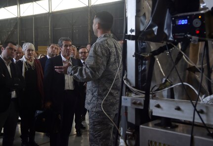 North Atlantic Treaty Organization Parliamentary Assembly Defense and Security Committee members are briefed by U.S. Air Force Maj. Scott King, 628th Aerospace Medicine Squadron bioenvironmental engineer flight commander, on the capabilities of a Transport Isolation System during a tour as part of a Congressional Delegation and NATO Partners event Feb. 8, at Joint Base Charleston, S.C. The visit provided NATO members an opportunity to speak with JB Charleston leadership, tour a C-17 Globemaster III, receive a briefing focused on aeromedical evacuation and learn about the Transportation Isolation System’s capabilities.