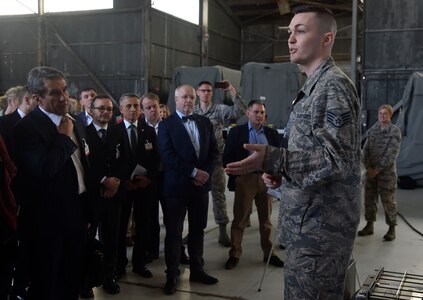 U.S. Air Force Staff Sgt. Peter Boyd, 628th Medical Support Squadron biomedical equipment NCO in charge, briefs North Atlantic Treaty Organization Parliamentary Assembly Defense and Security Committee members on the functions of a Transport Isolation System during a tour as part of a Congressional Delegation and NATO Partners event Feb. 8, at Joint Base Charleston, S.C. The visit provided NATO members an opportunity to speak with JB Charleston leadership, tour a C-17 Globemaster III, receive a briefing focused on aeromedical evacuation and learn about the Transportation Isolation System’s capabilities.