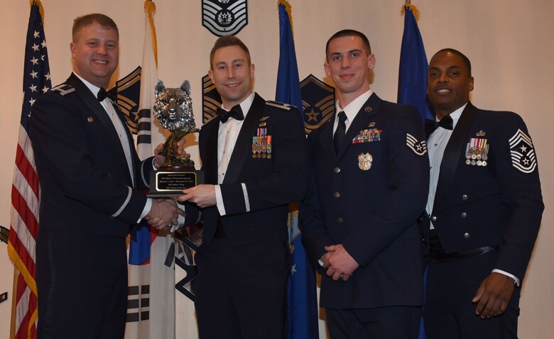 Winners of the 8th Fighter Wing 2017 Annual Awards pose for a photo during the "Night of the Stars" banquet at Kunsan Air Base, Republic of Korea, Feb. 9, 2018. The winners were selected at the top performers in their respective categories for the 2017 calendar year.