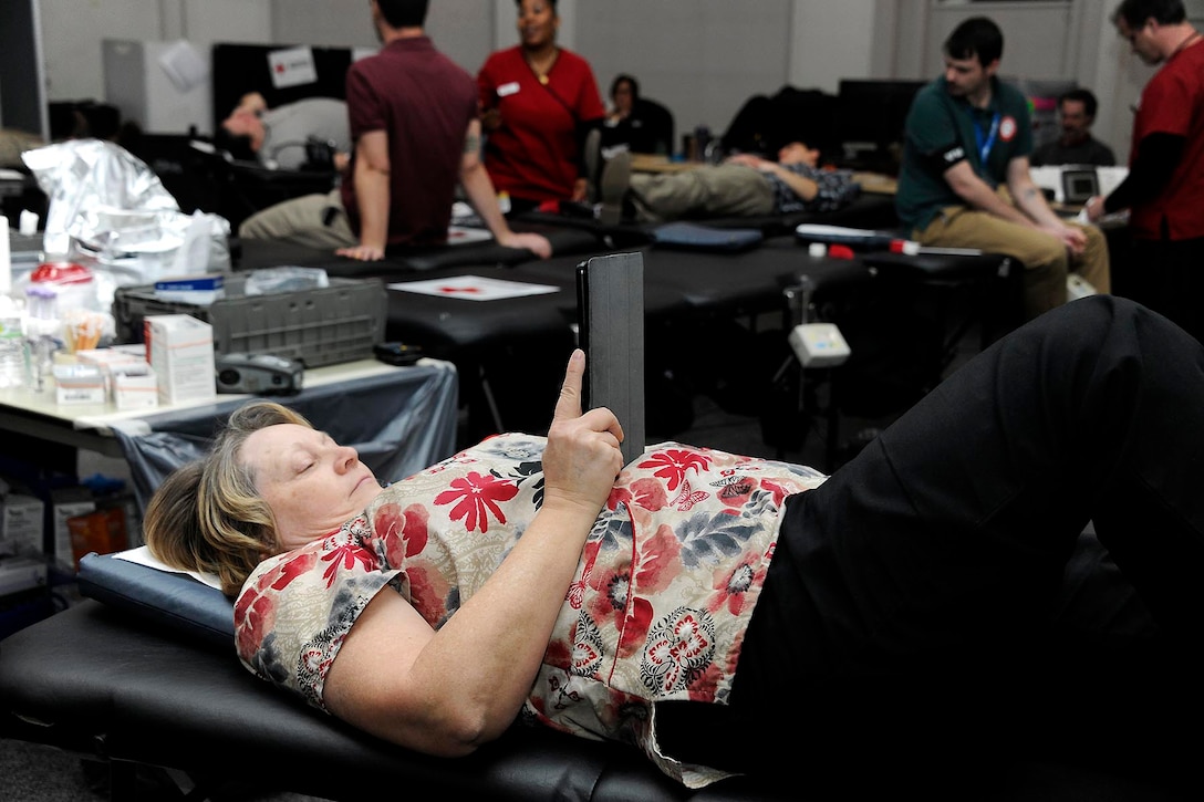 Occupational Health Nurse Sharon Butters, a Defense Logistics Agency employee, donates a pint herself at the Feb. 7 blood drive she helped to coordinate.