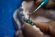 U.S. Air Force Airman 1st Class Jada Rivers, 86th Dental Squadron dental laboratory technician, fabricates a tooth for an implant at the dental clinic on Ramstein Air Base, Germany, Feb. 8, 2018. On average, the base dental laboratory receives more than 250 submissions a month. (U.S. Air Force photo by Senior Airman Devin Boyer)