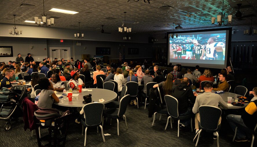 Members of Team BLAZE watch the Super Bowl LII coin flip Feb. 4, 2018, on ColumbusAir Force Base, Mississippi. Over 150 people were at the Columbus Club to watchthe game, where the Philadelphia Eagles defeated the New England Patriots 41-33. (U.S. Air Force photo by Airman 1st Class Keith Holcomb)