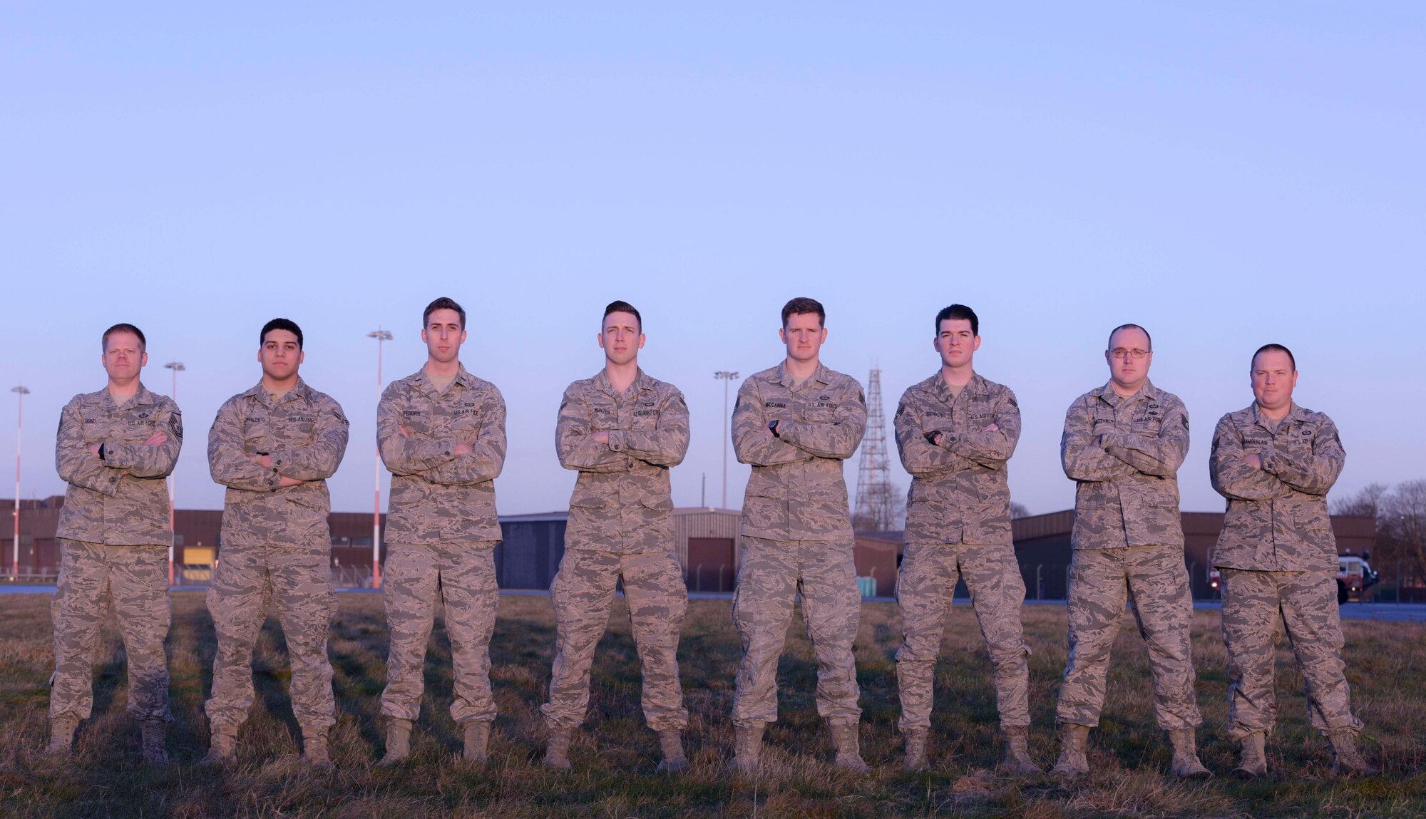 Weather forecasters from the 100th Operations Support Squadron’s weather flight pose for a photo near the runway at RAF Mildenhall, England, Feb. 1, 2018. The weather flight provides accurate forecasts for the aircrews in-flight. (U.S. Air Force photo by Senior Airman Kelly O’Connor)