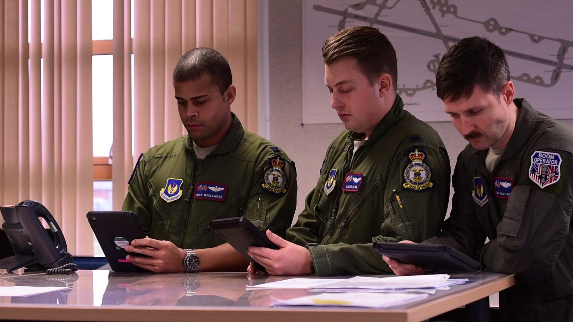 Pilots from the 351st Air Refueling Squadron receive weather briefs on their tablets prior to take-off at RAF Mildenhall, England, Feb. 1, 2018. The weather briefs contain information which helps with mission planning and execution. (U.S. Air Force photo by Senior Airman Kelly O’Connor)