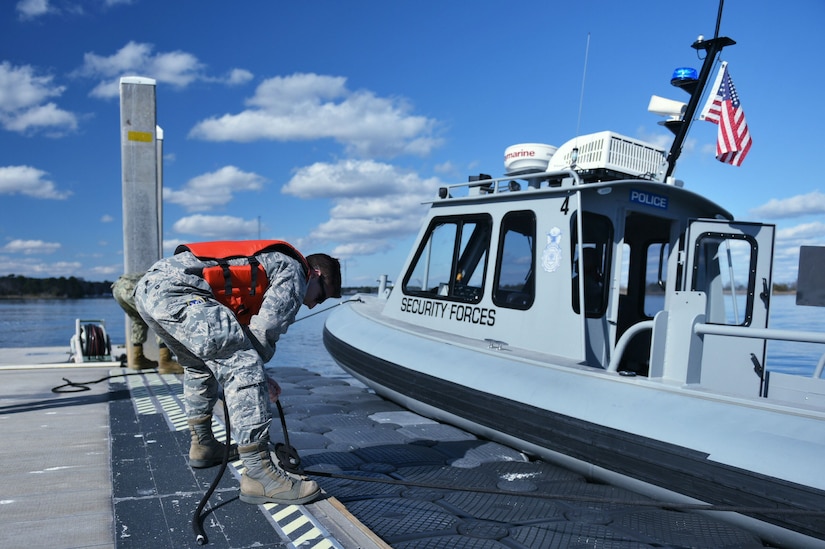 Christian “PJ” Padgett-Johnson, 628th Security Forces Squadron patrolman, secures a harbor patrol boat to a pier on the Naval Weapons Station at Joint Base Charleston, S.C. Feb 5, 2018