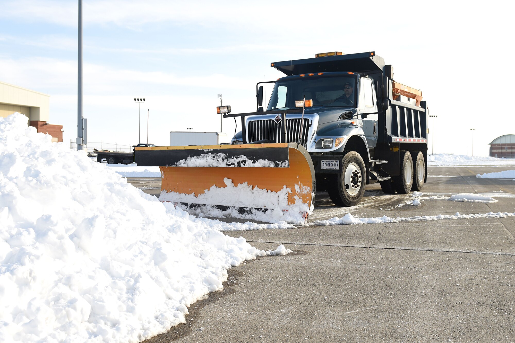 James Dutenhaver, a state employee assigned to the 178th Civil Engineering Squadron, plows snow Feb. 8 at Springfield Air National Guard in Springfield, Ohio. Dutenhaver has worked in the 178th CES for 16 years.