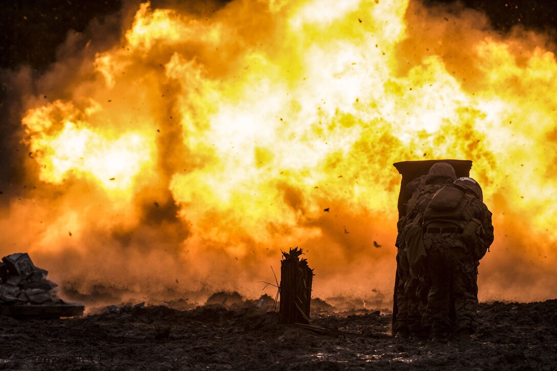 Marines in an Assultman Course with Infantry Training Battalion, School of Infantry East detonate a timber charge during a demolition and explosive training exercise at the ETA-7 engineer demolition training range on Marine Corps Base Camp Lejeune, N.C., Jan. 11, 2018. This exercise was held to demonstrate different demolition and explosive breaching training to develop proficiency in mobility support to infantry units.