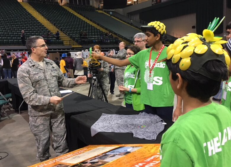 Maj. Gen.William Cooley, Air Force Research Laboratory commander, Wright-Patterson Air Force Base, explains how important it is for students to pursue STEM-related careers during the FIRST LEGO League Ohio Championship Tournament held Feb. 4 at Wright State University. (U.S.Air Force photo/Marie Vanover)
