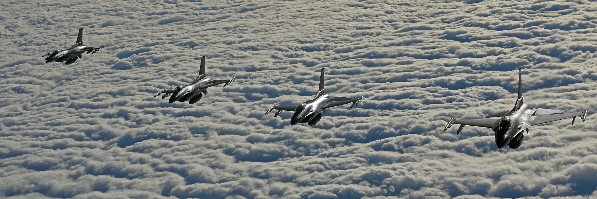 Four U.S. Air Force F-16C Fighting Falcons fly in formation during air refueling training in Swedish airspace, Feb. 8, 2018. The training was in conjunction with a rotational deployment of F-16Cs from the Ohio Air National Guard’s 180th Fighter Wing to Amari Air Base, Estonia, as part of a Theater Security Package. (U.S. Air Force photo by Airman 1st Class Luke Milano)