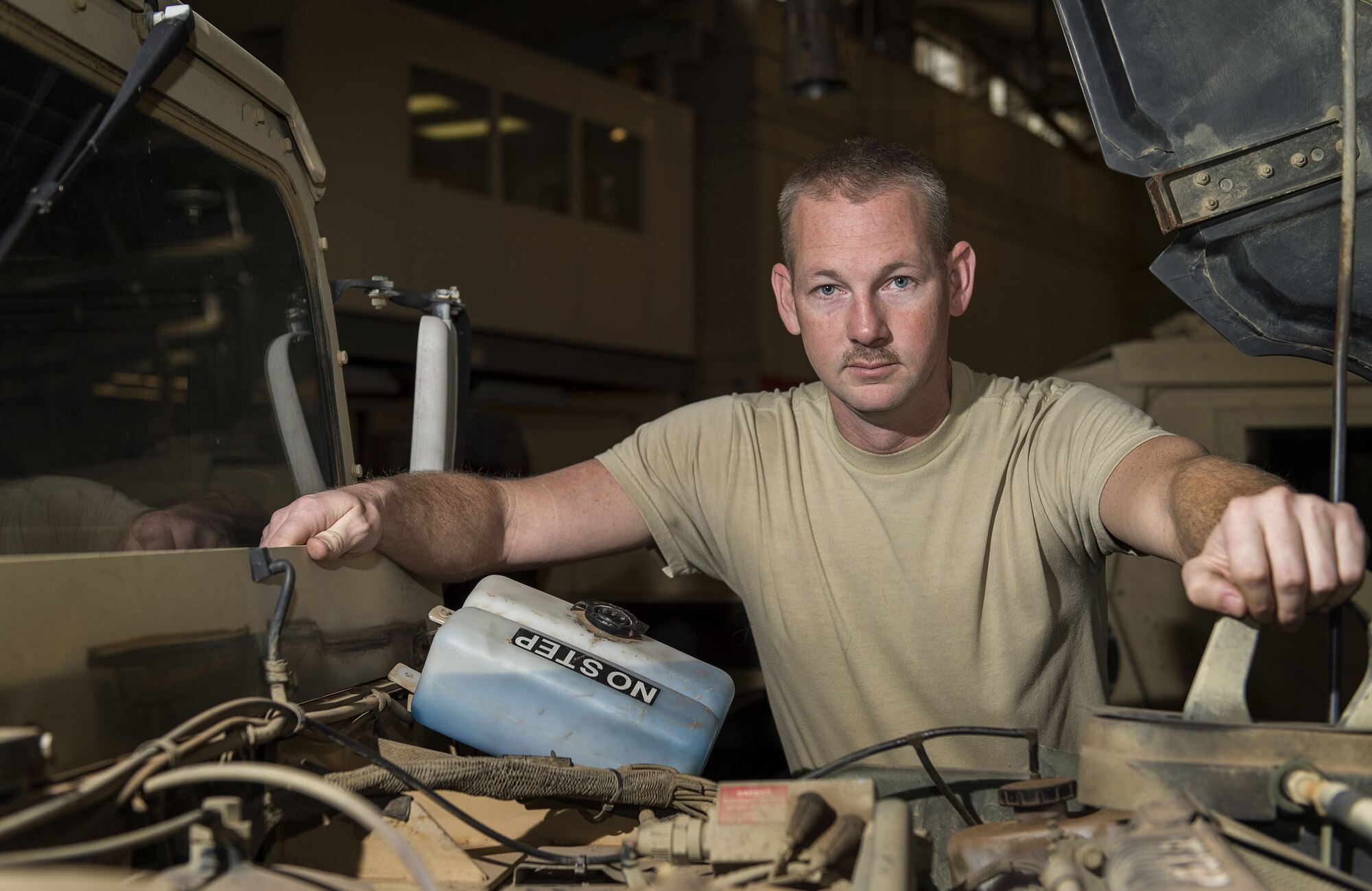 U.S. Air Force Tech. Sgt Robert Black, NCO in charge of main shop assigned to the 97th Logistics Readiness Squadron, poses for a portrait at the 97th LRS vehicle maintenance shop, Feb. 9, 2018, at Altus Air Force Base, Okla.