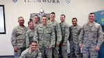 Staff Sgt. Nathan Ward (far right) poses for a group photo with his fellow 149th Fighter Wing members during a regularly scheduled drill weekend at his shop, headquartered at Joint Base San Antonio-Lackland, Texas.