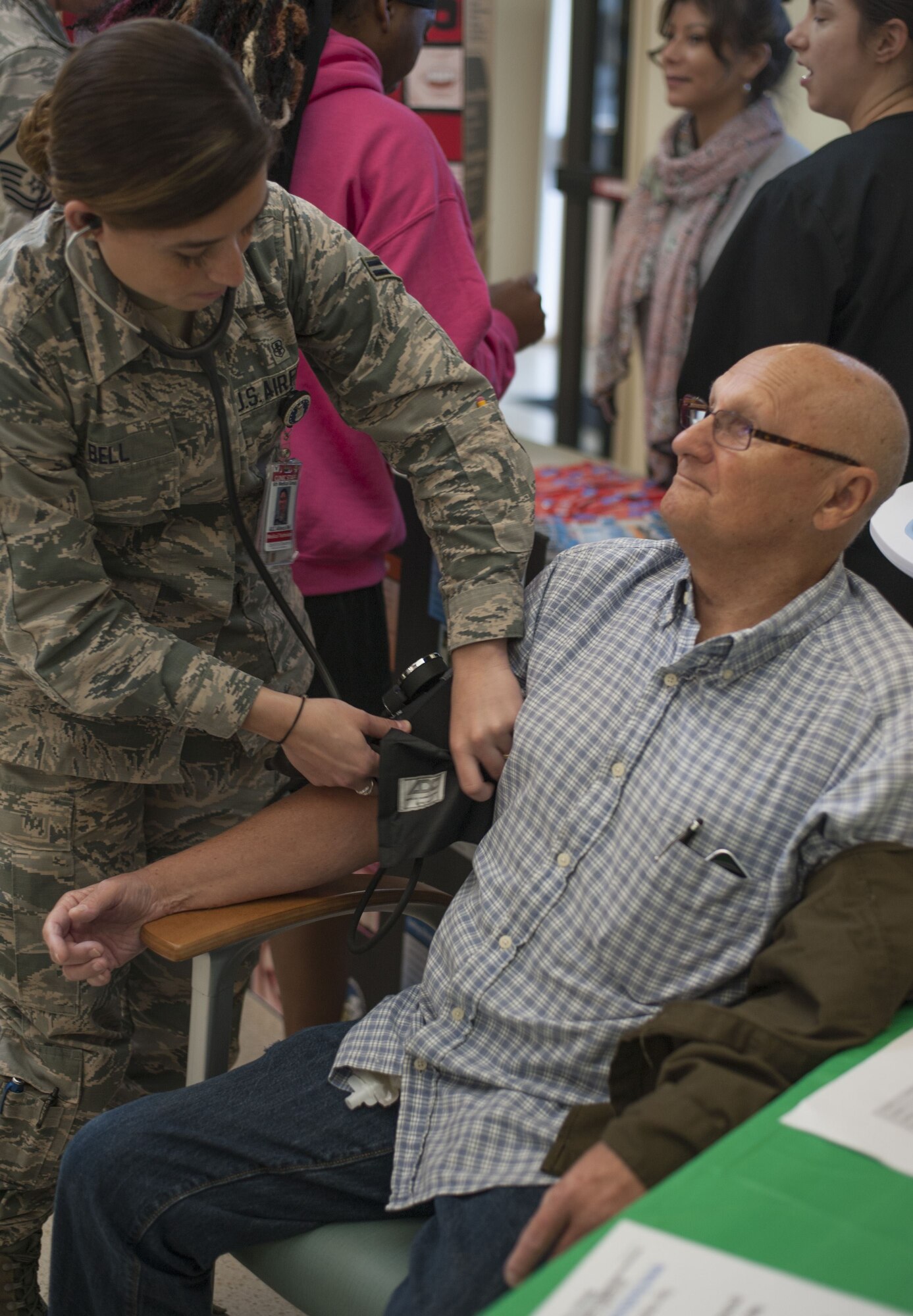 Arnold Lueth, a retired U.S. Army staff sergeant, receives a blood pressure screening from U.S. Air Force Airman 1st Class Allexus Bell, an aerospace medical technician assigned to the 6th Medical Operations Squadron, during Retiree Appreciation Day at MacDill Air Force Base, Fla., Feb. 8, 2018.