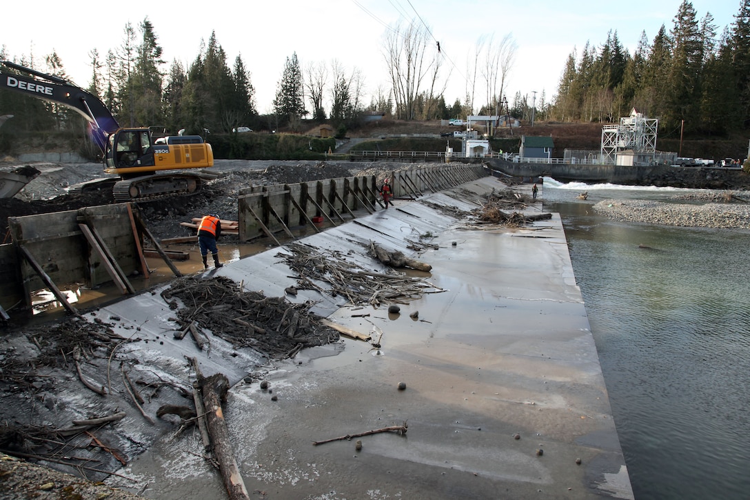 Workers repair the White River Diversion Dam near Buckley, Washington.