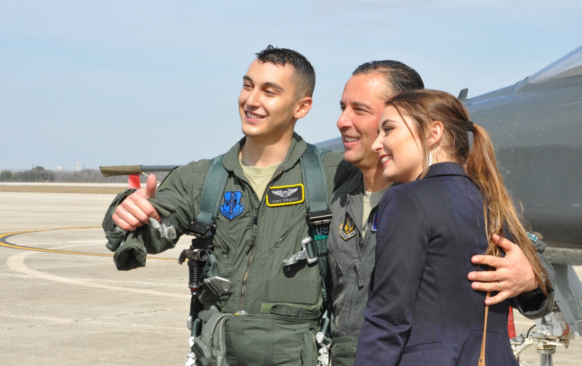Joe, Chris and Brianna Mirarchi share a photo opportunity following the fini flight. (U.S. Air Force photo by Debbie Gildea)