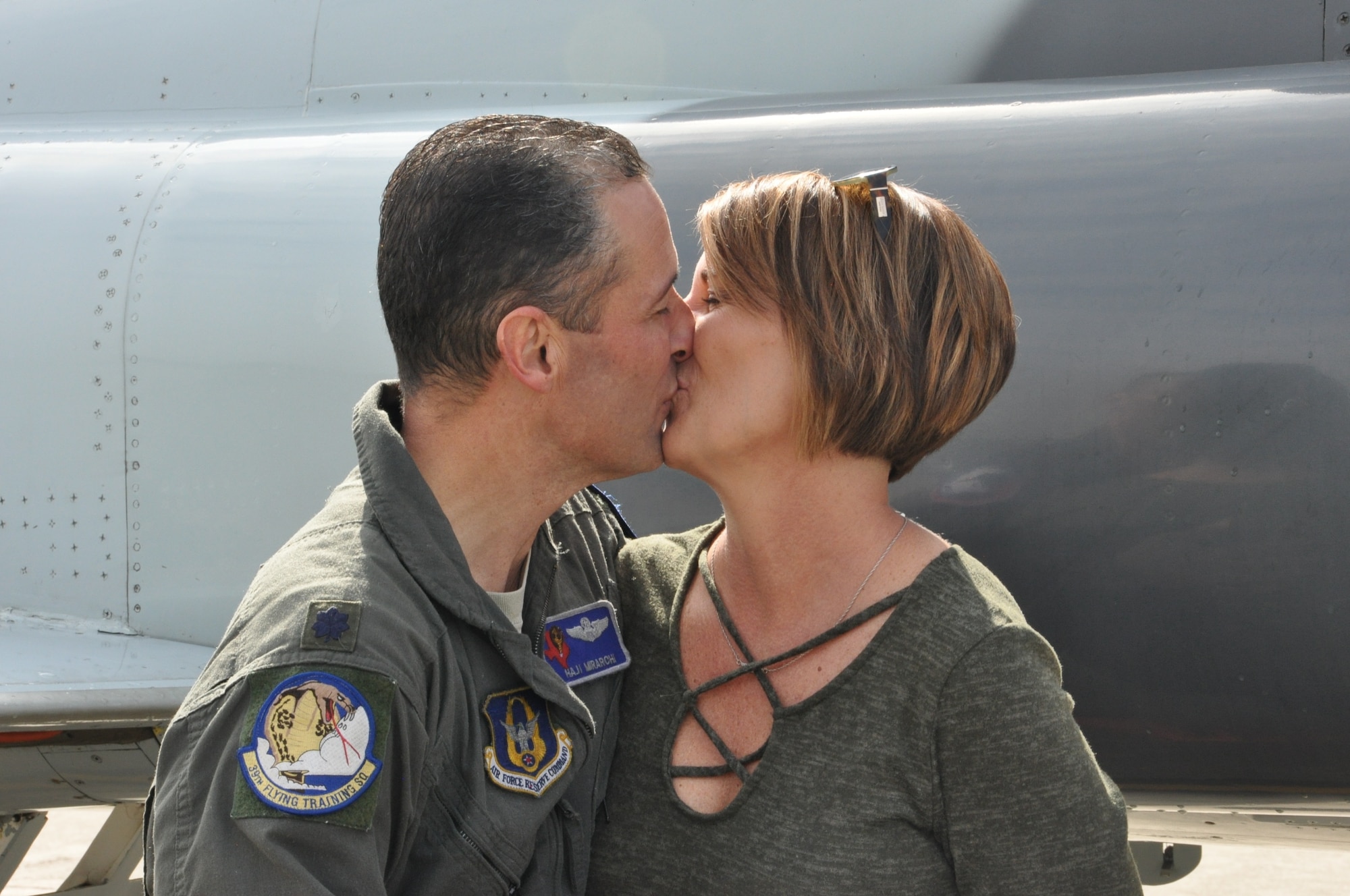 Colonel Mirarchi greets his wife, Teresa, following his successful fini flight. (U.S. Air Force photo by Debbie Gildea)