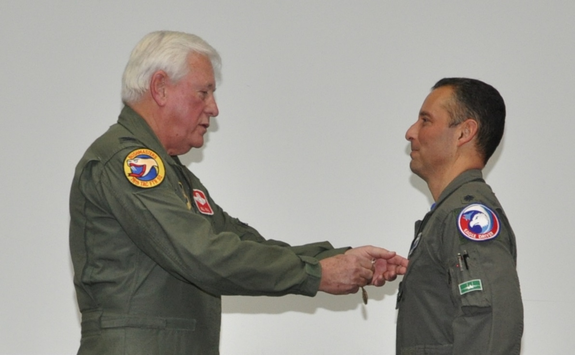 Colonel William Rial (USAF, retired) pins the USAF Meritorious Service Medal on Colonel Mirarchi during the formal retirement ceremony. (U.S. Air Force photo by Debbie Gildea)