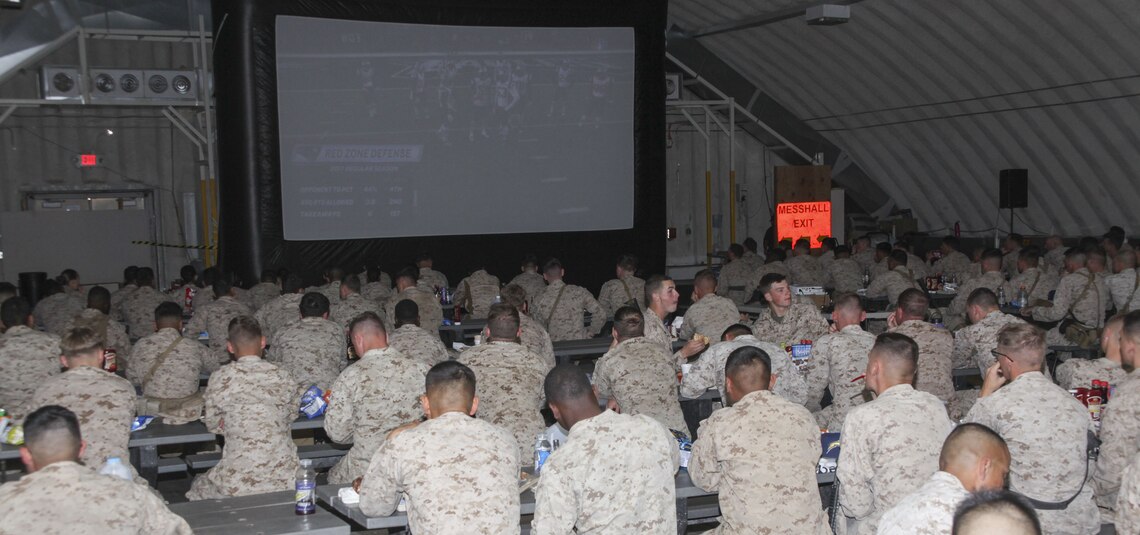 Marines and sailors watch Super Bowl LII on a large screen television in the Camp Wilson Mess Hall aboard the Marine Corps Air Ground Combat Center, Twentynine Palms, Calif., Feb. 4, 2018. The United Services Organization hosted the event to provide Marines and sailors with a way to enjoy the game while in the field. (U.S. Marine Corps photo by Cpl. Natalia Cuevas)