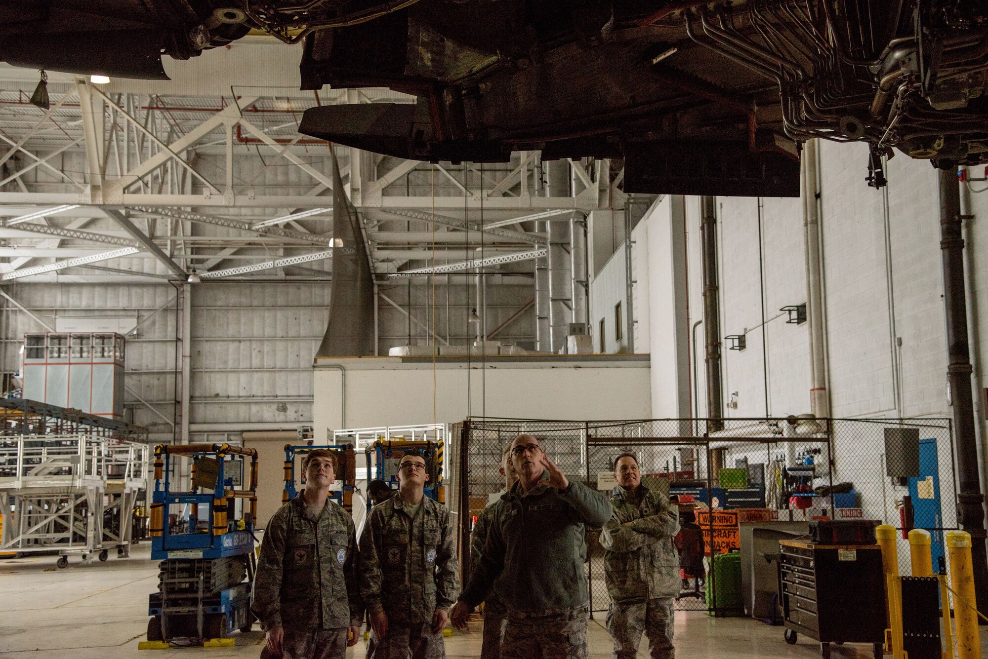 Chief Master Sgt. Bryan Ford, 512th Maintenance Squadron superintendent, explains jet engine mechanics to cadets on a tour Jan. 30, 2018, at Dover Air Force Base, Del. The cadets were invited to tour both C-17 Globemaster III and C-5M Super Galaxy aircraft. (U.S. Air Force photo by Senior Airman Damien Taylor)