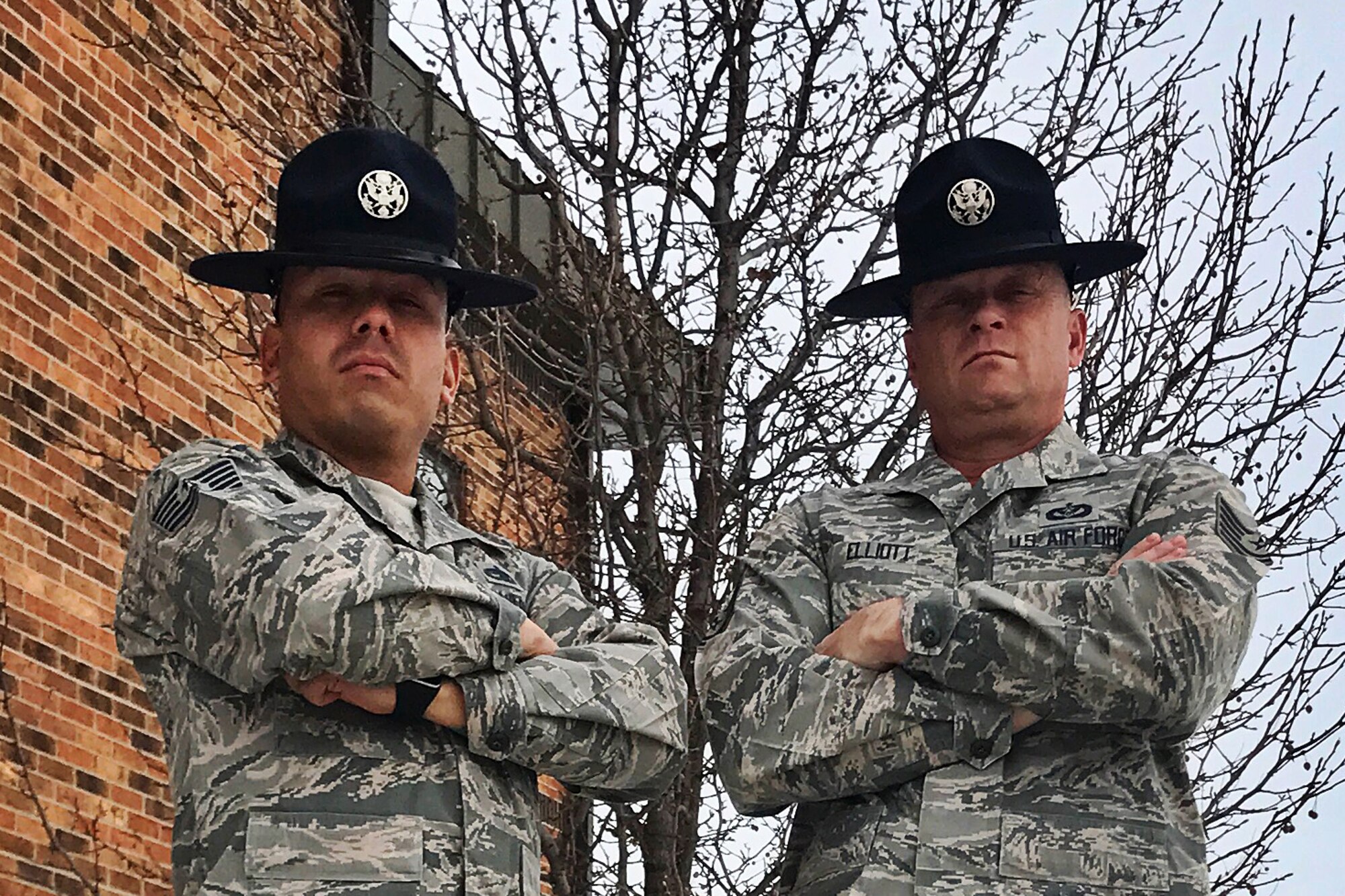 Tech. Sgt. Robert Elliott and Tech. Sgt. Jack Lozano, 433rd Training Squadron military training instructors, pose for a photo at Grissom Air Reserve Base, Ind., Jan. 6, 2017. Their main goal during their visit was to educate and recruit potential traditional reservists in an effort to retain qualified Airmen interested in joining the MTI corps.