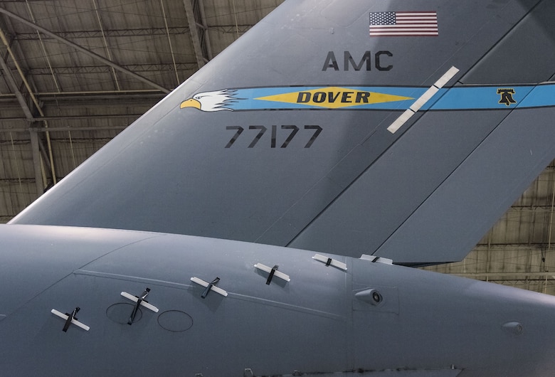 736th Aircraft Maintenance Squadron personnel installed 12 Microvanes, six on each side at the rear of a C-17 Globemaster III fuselage, Sept. 6, 2017, at Dover Air Force Base, Del. The 3D printed glass bead filled nylon Microvanes are 2.4 inches tall and 16 inches in length. This is an effort to reduce drag and fuel consumption. (U.S. Air Force photo by Roland Balik)