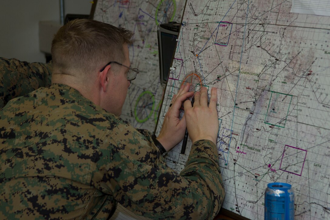 Master Sgt. Michael D. Wallace, fire support representative, Tactical Training Exercise Control Group, participates in a Rehearsal of Concept walk in the TTECG building aboard the Marine Corps Air Ground Combat Center, Twentynine Palms, Calif., Jan. 31, 2018. ROC walks are a form of practice for intensive strategy and quick thinking. (U.S. Marine Corps photo by Pfc. Rachel K. Porter)