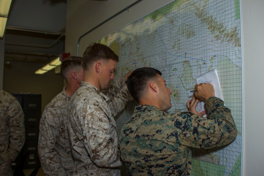 Marines with III Marine Expeditionary Force conduct a Rehearsal of Concept walk at the Tactical Training Exercise Control Group building aboard the Marine Corps Air Ground Combat Center, Twentynine Palms, Calif., Jan. 31, 2018. ROC walks are a form of practice for intensive strategy and quick thinking. (U.S. Marine Corps photo by Pfc. Rachel K. Porter)