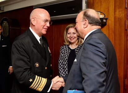 Adm. Kurt Tidd greets Colombia's minister of defense.
