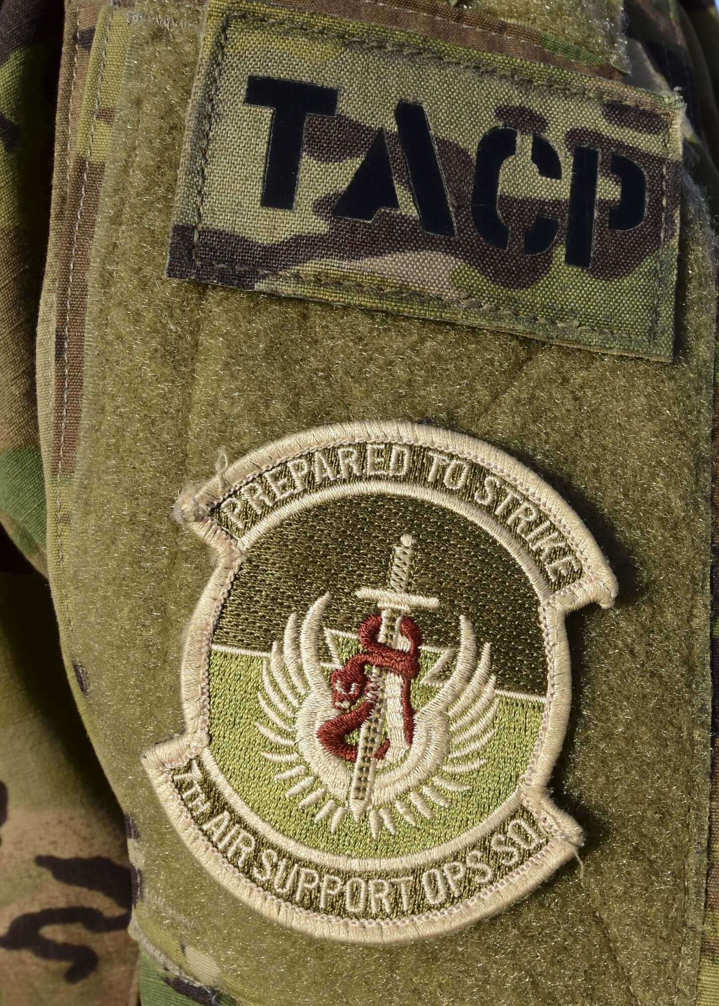 Tactical Air Control Party and 7th Air Support Operations Squadron patches on a Joint Terminal Attack Controller's Army Combat Uniform during joint training at Whiteman Air Force Base, Mo., Jan. 31, 2018. JTACs participated in a joint training, titled Truman Relief, with the 509th Bomb Wing and 1-135th Assault Helicopter Battalion at Whiteman Air Force Base, Mo., Jan. 29 - Feb. 2, 2018. (U.S. Air Force by Staff Sgt. Danielle Quilla)