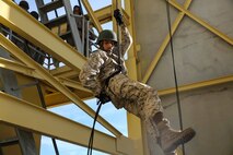 A recruit of Kilo Company, 3rd Recruit Training Battalion, descends a rappel tower at Marine Corps Recruit Depot San Diego, Feb. 2. One of the techniques learned was how to apply a “brake hand,” which is used to adjust the speed while descending the tower. The recruits were given gloves to protect their hands as well as to serve as an extra grip on the rope and a helmet and harness were worn for safety. Annually, more than 17,000 males recruited from the Western Recruiting Region are trained at MCRD San Diego. Kilo Company is scheduled to graduate March 16.

(Photo by: Lance Cpl. Christian M. Garcia)