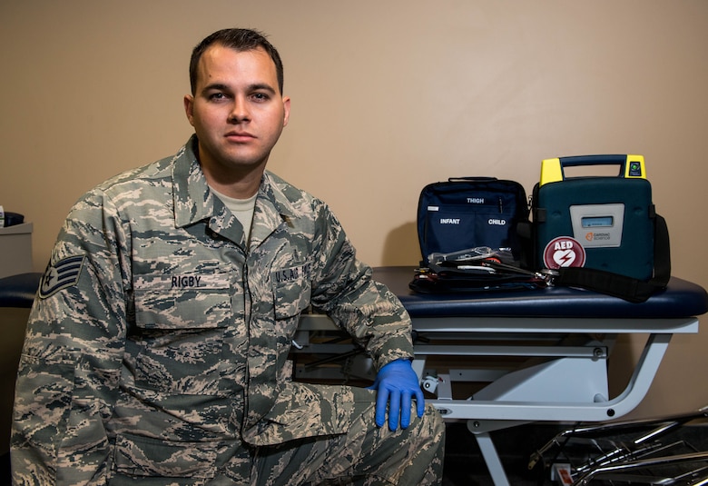 Staff Sgt. Geoffrey Rigby, 56th Medical Operations Squadron physical therapy technician, poses in front of emergency medical equipment at Luke Air Force Base, Feb. 6, 2018. Rigby helped to save a life using his medical knowledge and training after a car accident Jan. 16 in Glendale, Ariz. (U.S. Air Force photo/Airman 1st Class Alexander Cook)