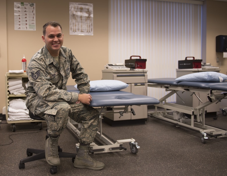 Staff Sgt. Geoffrey Rigby, 56th Medical Operations Squadron physical therapy technician, poses in the physical therapy clinic at Luke Air Force Base, Feb. 6, 2018. Rigby used his lifelong medical knowledge and training to apply life-saving techniques to a car accident victim on Jan. 16 in Glendale, Ariz. (U.S. Air Force photo/Senior Airman Ridge Shan)