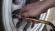 U.S. Air Force Staff Sgt. Charles Bolles, a Pacific Air Forces' F-16 Demonstration Team crew chief, measures the tire pressure of an F-16 Fighting Falcon at Paya Lebar Air Base, Singapore, Feb. 3, 2018.