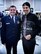 Community thank you in action: The 932nd Airlift Wing made a visit to Belleville West High School on Feb. 8, 2018, to thank the "Maroon" marching band for attending and playing songs "live" at a recent deployer's send off event. Here, the highest ranking enlisted member, 932nd Command Chief Master Sgt. Chad Welch, presented a recycled special C-40 aircraft window to Belleville West band directors, Scott Wilson (seen here) and Michael Pond-Jones (not pictured).  It was engraved with a "token of appreciation" message for the volunteer work the band did while performing at Scott Air Force Base. (U.S. Air Force photo by Lt. Col. Stan Paregien)