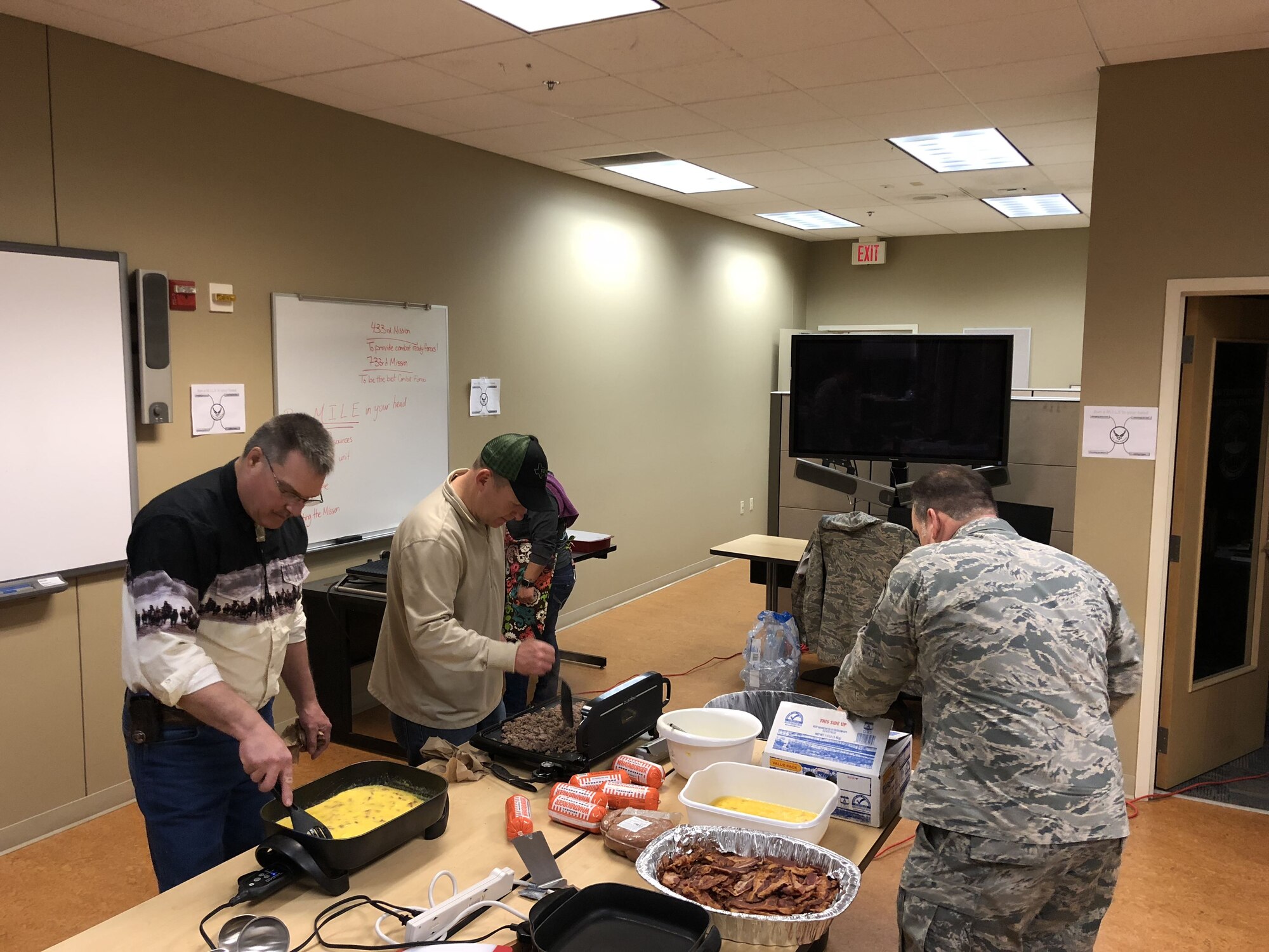 Members from various 433rd Airlift Wing councils braved the cold weather, Feb. 7, 2018, to prepare breakfast for Reserve Citizen Airmen during the Annual Wing Cowboy Breakfast. (U.S. Air Force photo by Minnie Jones)