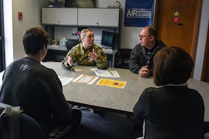 Tech. Sgt. Heather Kane, a production recruiter with the 193rd Special Operations Wing, conducts an informal interview with a potential Air National Guard enlistee. Topics such as benefits, basic military training and choosing an Air Force career field were discussed. (U.S. Air National Guard photo by Senior Airman Julia Sorber/ Released)