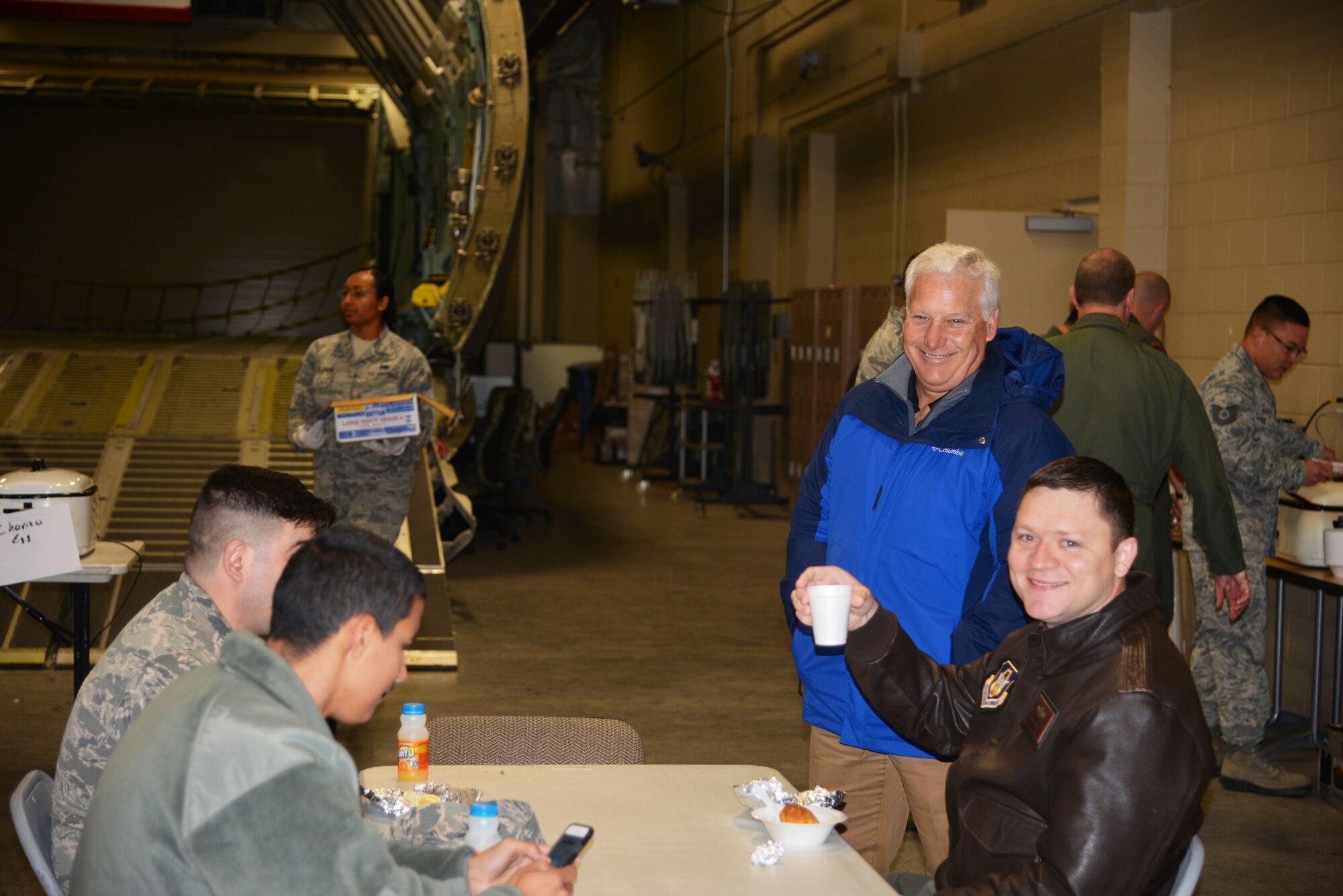 Don Hall and Maj. Samuel McAnally, 433rd Airlift Wing Safety Office, enjoy a free breakfast Feb. 7, 2018, hosted by varies councils within the Alamo Wing, at their Annual Wing Cowboy Breakfast. (U.S. Air Force photo by Minnie Jones)