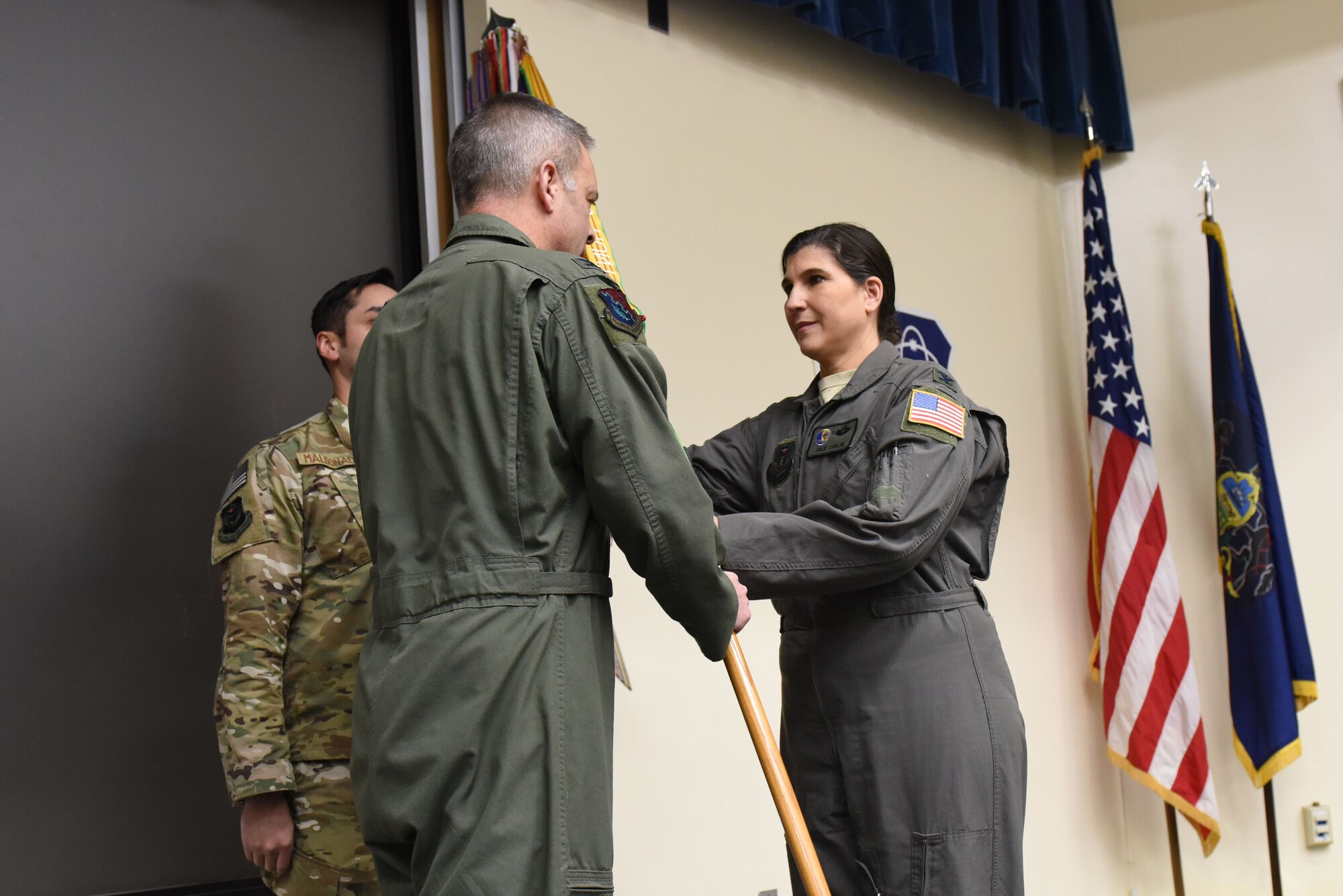 U.S. Air Force Col. Julie Curlin, 193rd Special Operations Group commander, Pennsylvania Air National Guard, accepts the guidon from Col. Mike Cason, 193rd Special Operations Wing commander, during an assumption of command ceremony Feb. 11, 2018, in Middletown, Pennsylvania. The ceremony began with preliminary honors and ended with the symbolic passing of the guidon. (U.S. Air National Guard photo by Senior Airman Juila Sorber/Released)