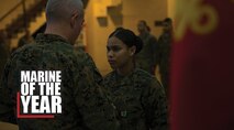 Brig. Gen. Daniel B. Conley, left, commanding general, 3rd Marine Logistics Group, presents Cpl. Nelfi Tineoferreiras, the noncommissioned officer-in-charge of Receiving Section, Supply Company, Combat Logistics Regiment 35, 3rd MLG, with the III Marine Expeditionary Force’s Marine of the Year at Camp Kinser, Okinawa, Japan, Feb. 8, 2018. Tineoferreiras was honored as III MEF’s Marine of the Year for being exemplary in her duties, which included her technical proficiency and demonstration of the Marine Corps' core values. Tineoferreiras is a native of the Dominican Republic and was recruited into the Marine Corps from Brooklyn, New York. (U.S. Marine Corps photo by Lance Cpl. Jamin M. Powell)